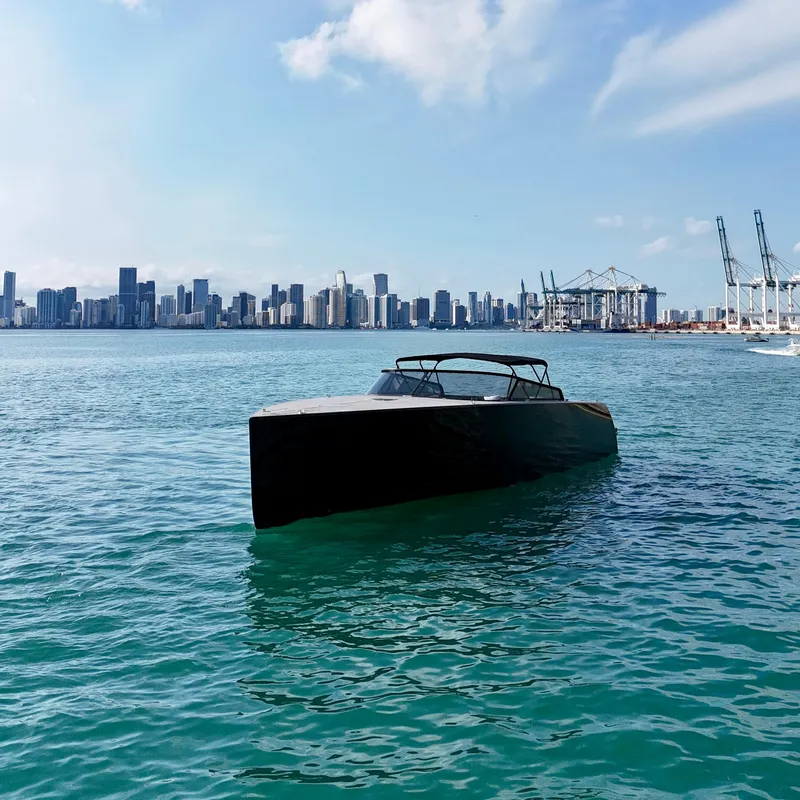 Slide: The Image of VanDutch 55 yacht on water with city skyline in background, 2014 model. - 20