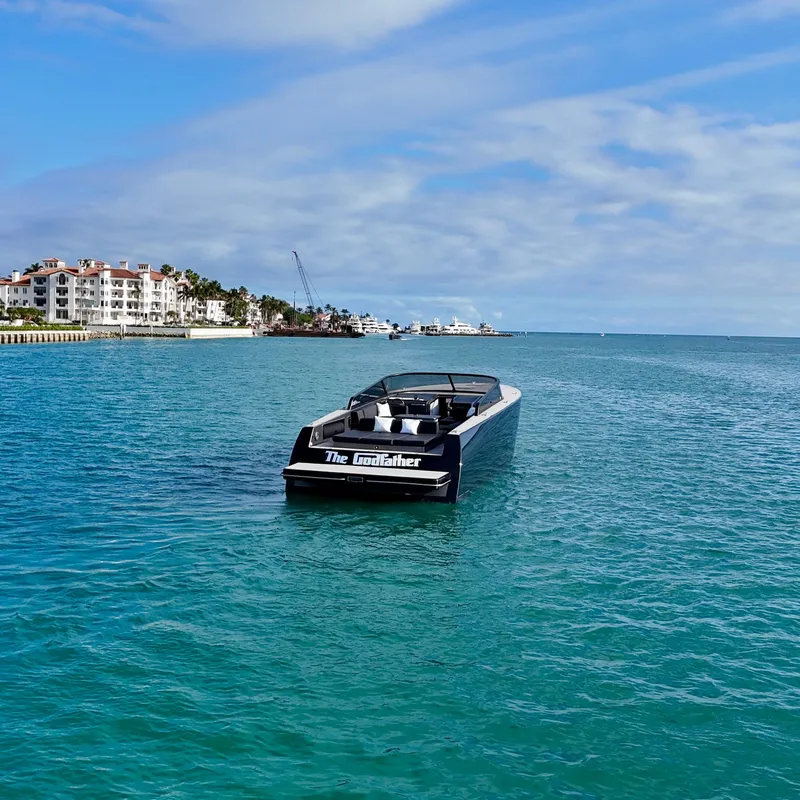 Slide: The Image of 2014 VanDutch 55 yacht cruising in clear blue waters near coastal buildings. - 24