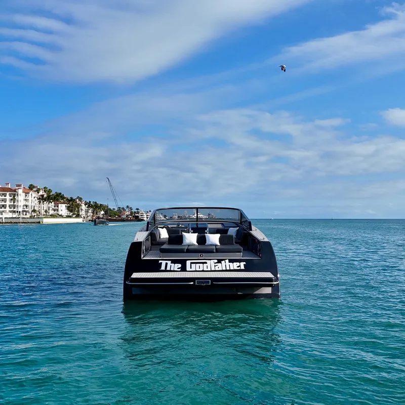 Slide: The Image of VanDutch 55 yacht named "The Godfather" on serene blue waters, 2014 model. - 29