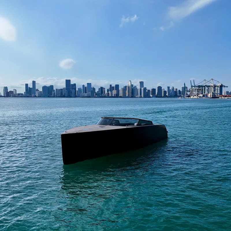 Slide: The Image of VanDutch 55 yacht on water with city skyline in background, 2014 model. - 36