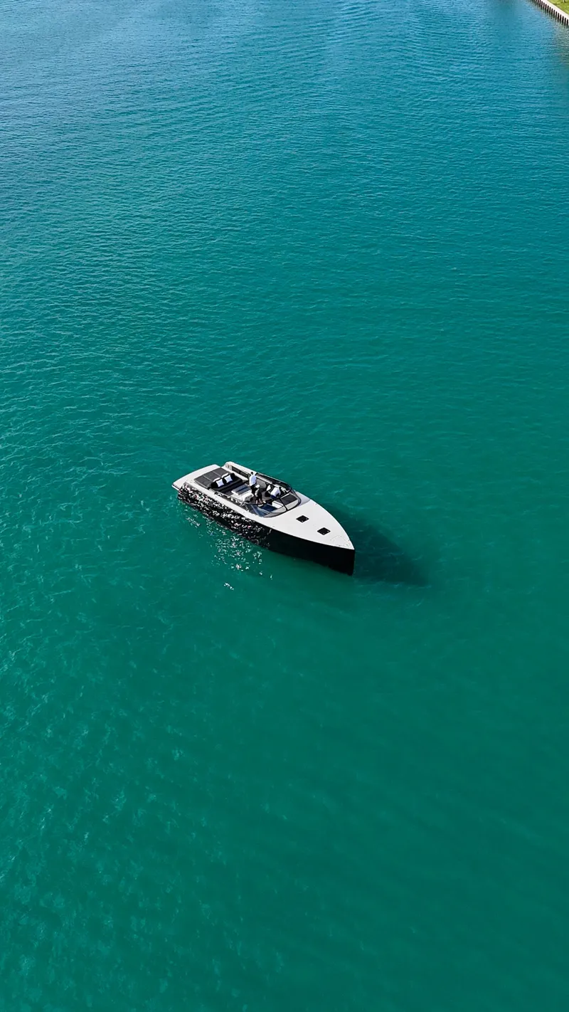 Slide: The Image of Aerial view of 2014 VanDutch 55 yacht on turquoise water. - 39