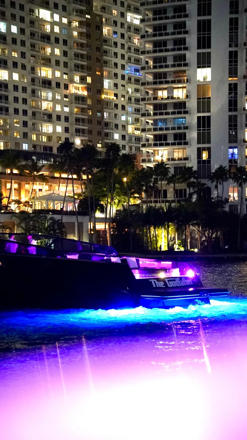 Slide: The Image of VanDutch 55 yacht illuminated at night near city buildings, 2014 model. - 49