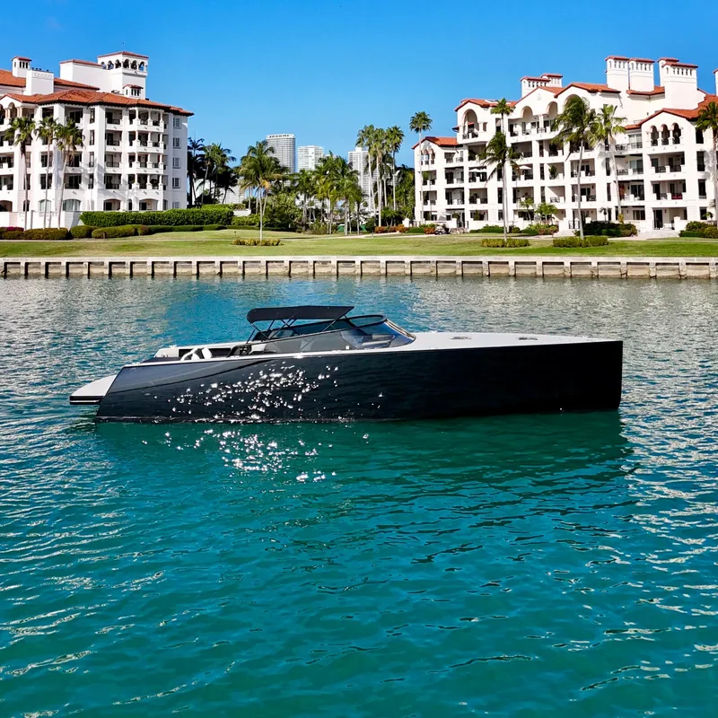 Slide: The Image of VanDutch 55 yacht from 2014 on turquoise water, with luxury waterfront buildings in the background. - 6