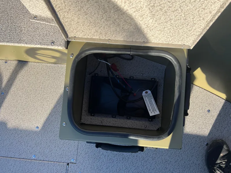 Slide: The Image of 2025 Lund 1875 Alaskan SS boat compartment with wiring visible. - 12