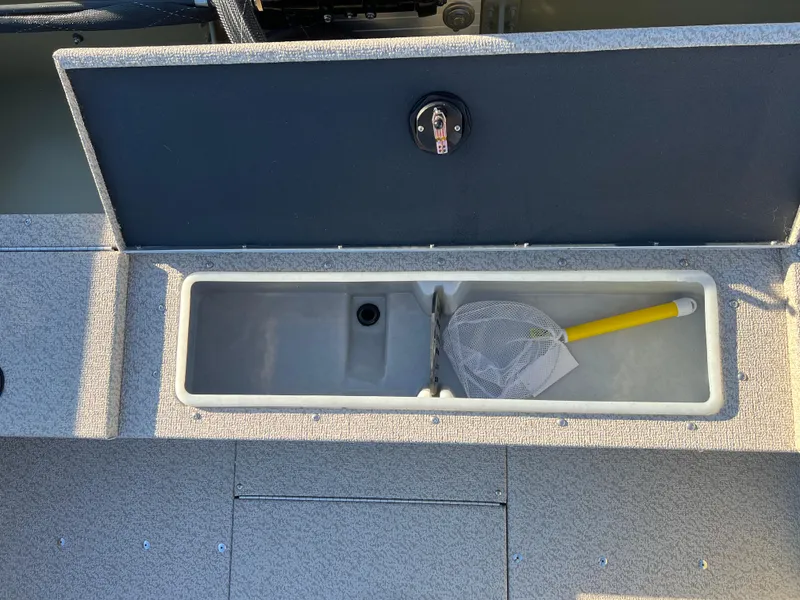 Slide: The Image of 2025 Lund 1875 Alaskan SS boat storage compartment with fishing net inside. - 20