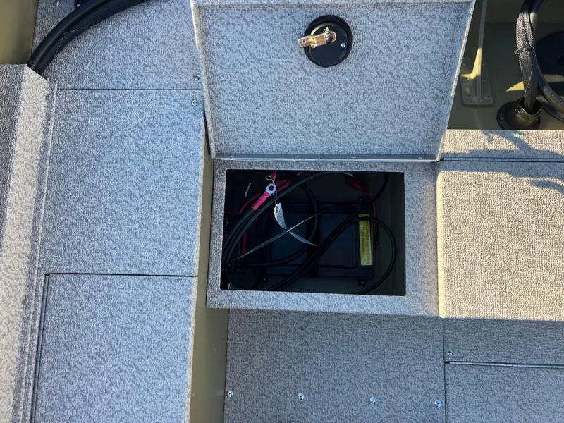 Slide: The Image of 2025 Lund 1875 Alaskan SS boat battery compartment with open hatch. - 21