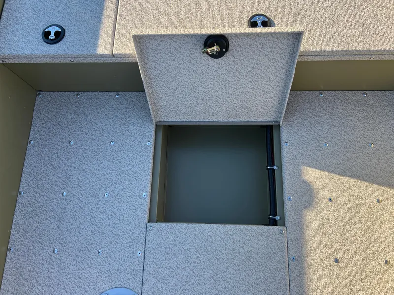 Slide: The Image of 2025 Lund 1875 Alaskan SS boat storage compartment with open hatch. - 22