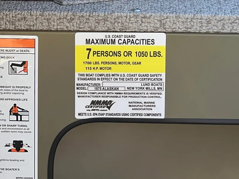 Slide: The Image of U.S. Coast Guard capacity label for 2025 Lund 1875 Alaskan SS boat, 7 persons or 1050 lbs. - 23
