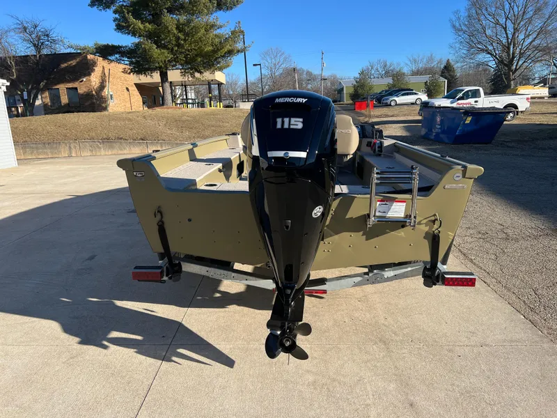Slide: The Image of 2025 Lund 1875 Alaskan SS boat with Mercury 115 engine, parked outdoors. - 5