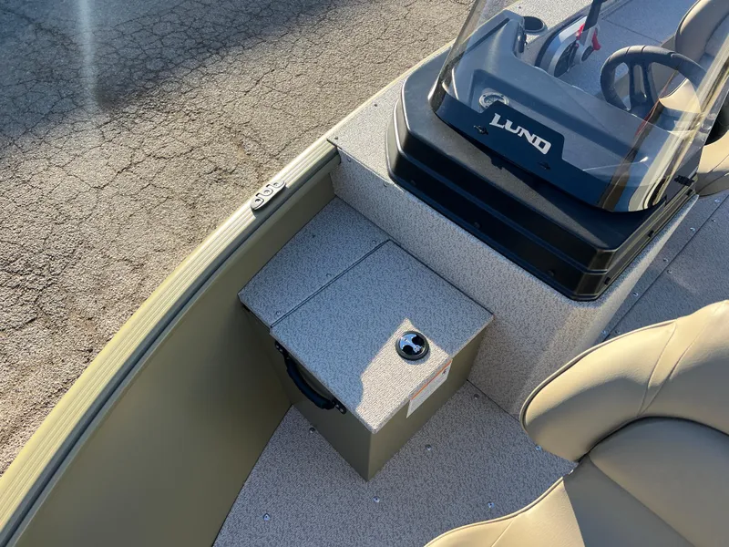 Slide: The Image of 2025 Lund 1875 Alaskan SS boat interior with steering console and seating. - 9