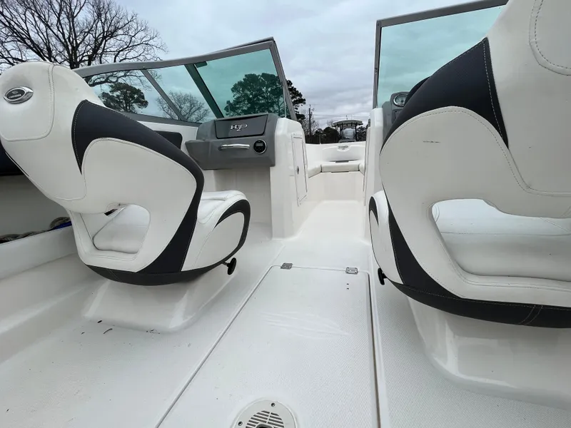 Slide: The Image of 2014 Chaparral 19 Sport H2O boat interior with white and black seating. - 11