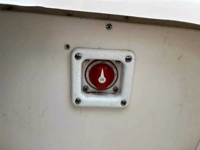Slide: The Image of Red switch on 2014 Chaparral 19 Sport H2O boat panel. - 15