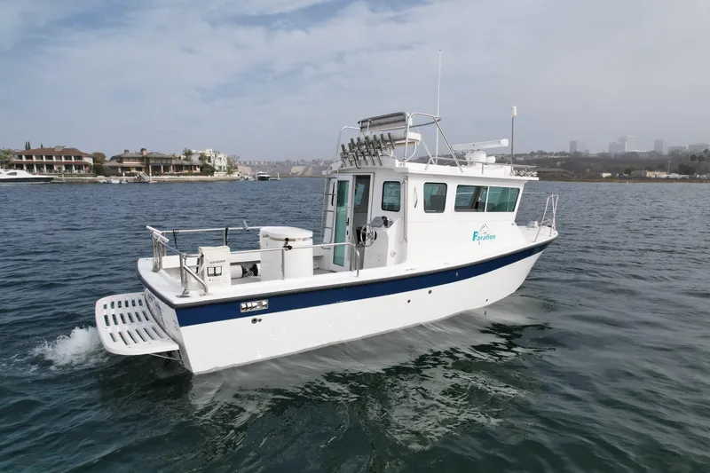 Slide: The Image of 2012 Farallon 2800 Whaleback boat cruising on calm waters. - 2