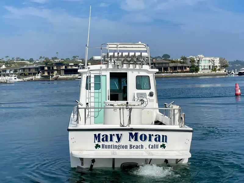 Slide: The Image of Farallon 2800 Whaleback boat, 2012 model, in Huntington Beach waters. - 3