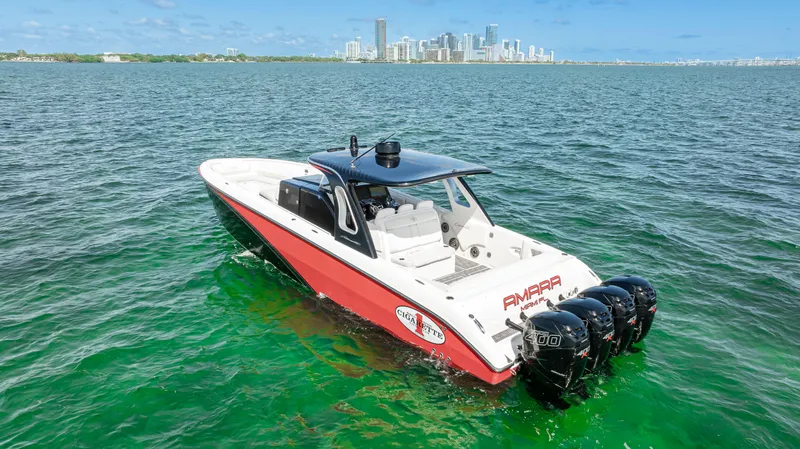 Slide: The Image of 2016 Cigarette 41 GTR boat on water with city skyline in background. - 11