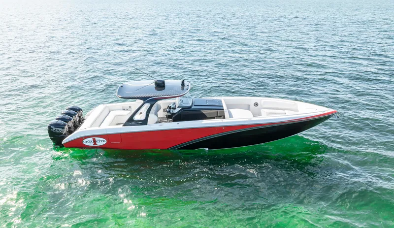 Slide: The Image of 2016 Cigarette 41 GTR boat on open water, featuring a sleek red and black design. - 14