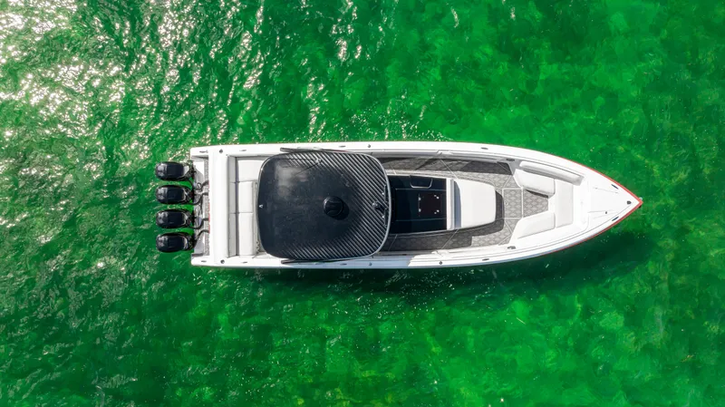 Slide: The Image of Aerial view of 2016 Cigarette 41 GTR boat on vibrant green water. - 16