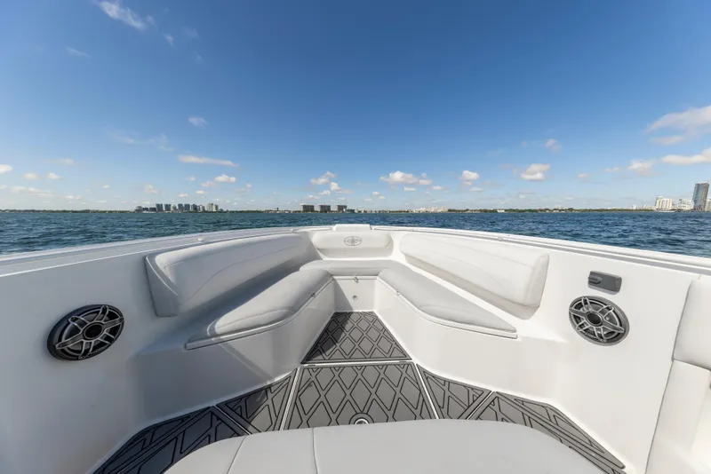 Slide: The Image of 2016 Cigarette 41 GTR boat interior with seating, speakers, and ocean view. - 18