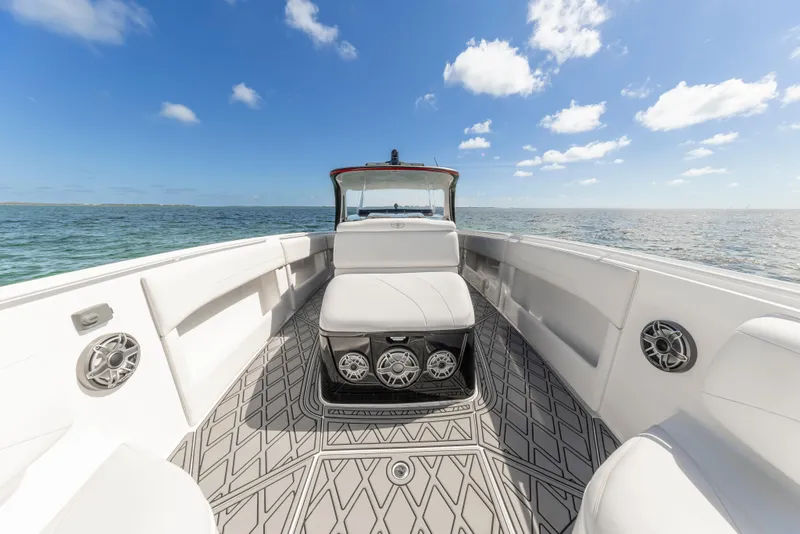 Slide: The Image of 2016 Cigarette 41 GTR boat interior with white seating and ocean view. - 22