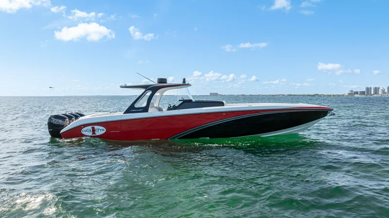 Slide: The Image of 2016 Cigarette 41 GTR speedboat on open water under clear blue sky. - 5