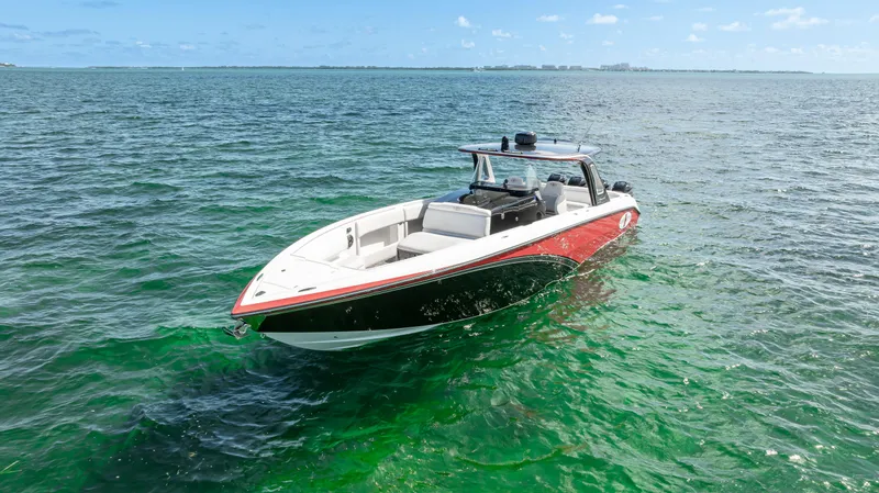 Slide: The Image of 2016 Cigarette 41 GTR boat on clear ocean water. - 9