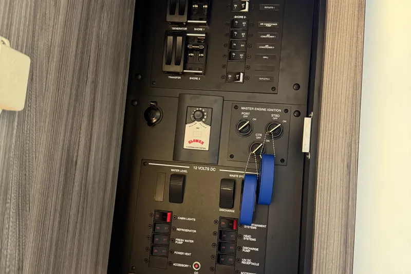 Slide: The Image of Electrical panel of 2020 Sea Ray 32 Sundancer Outboard boat, featuring switches and controls. - 10