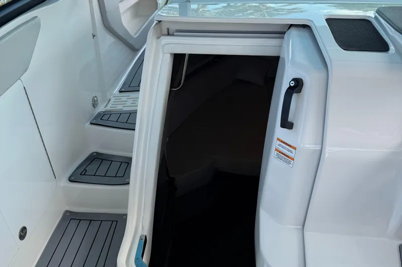 Slide: The Image of 2020 Sea Ray 32 Sundancer Outboard cabin entrance with sleek interior design. - 20