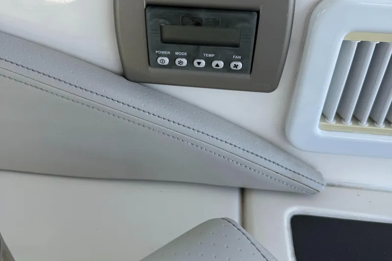 Slide: The Image of Control panel and vent on 2020 Sea Ray 32 Sundancer Outboard boat interior. - 6