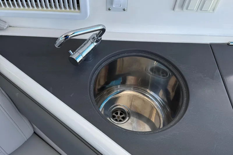 Slide: The Image of Stainless steel sink and faucet on 2020 Sea Ray 32 Sundancer Outboard boat. - 7