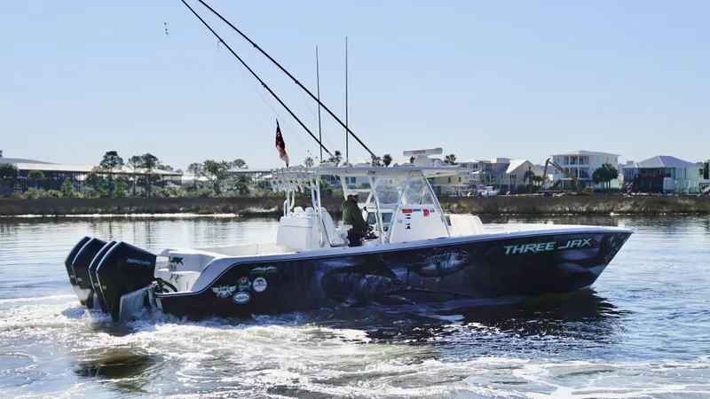 The Image of Invincible 35 Catamaran 2021 cruising on water, featuring sleek design and powerful engines. - 1