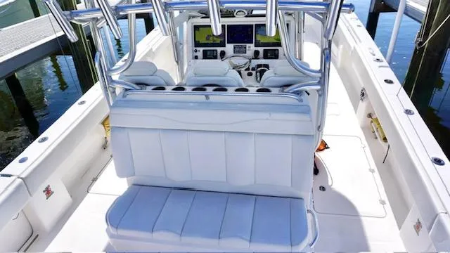 Slide: The Image of 2021 Invincible 35 Catamaran interior with white seating and advanced navigation system. - 12