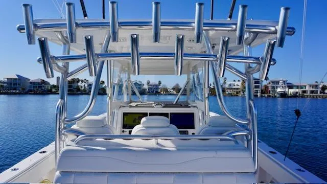 Slide: The Image of 2021 Invincible 35 Catamaran with rod holders, on calm water, clear sky background. - 15