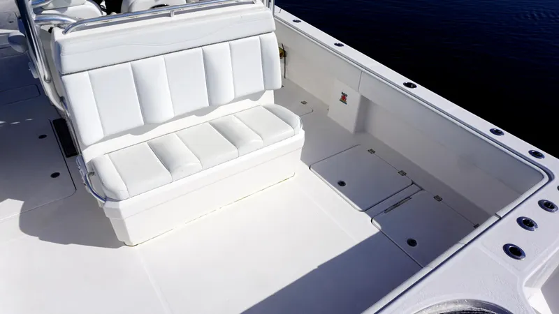 Slide: The Image of Invincible 35 Catamaran 2021 interior with white seating and spacious deck. - 16