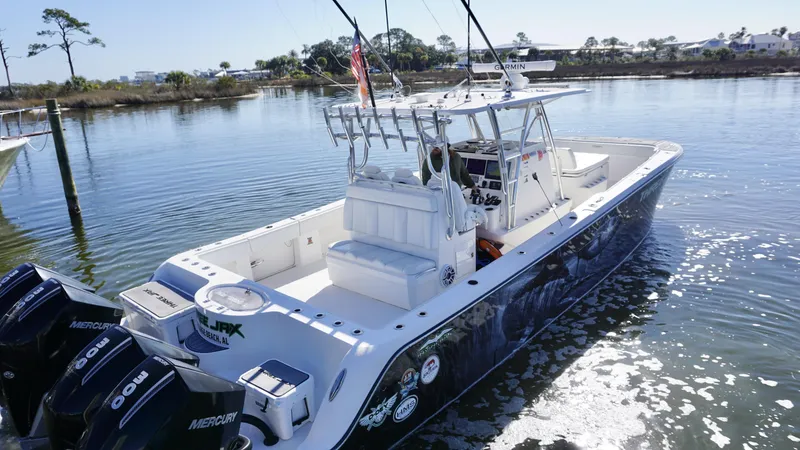 Slide: The Image of 2021 Invincible 35 Catamaran on calm water, featuring dual Mercury engines. - 7