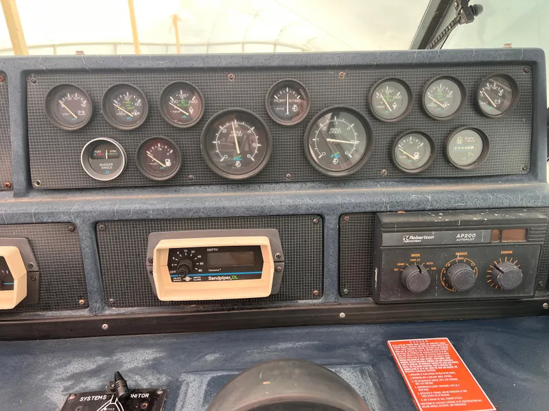 Slide: The Image of Dashboard of 1989 Sea Ray 390 Express Cruiser with Garmin GPS device. - 12