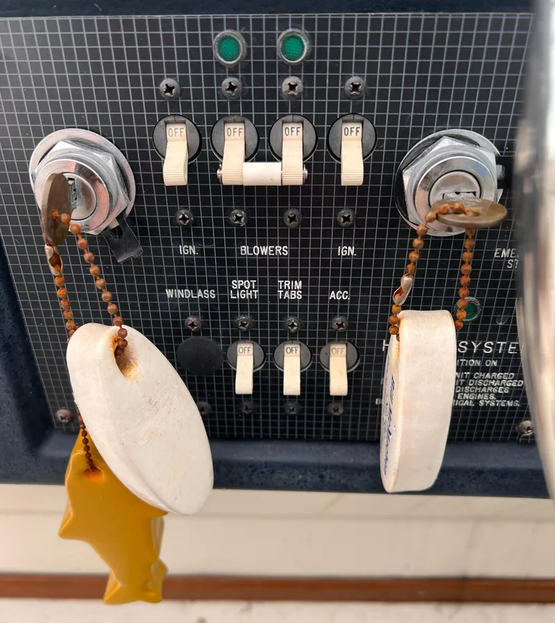 Slide: The Image of Control panel of a 1989 Sea Ray 390 Express Cruiser with switches and indicators. - 17