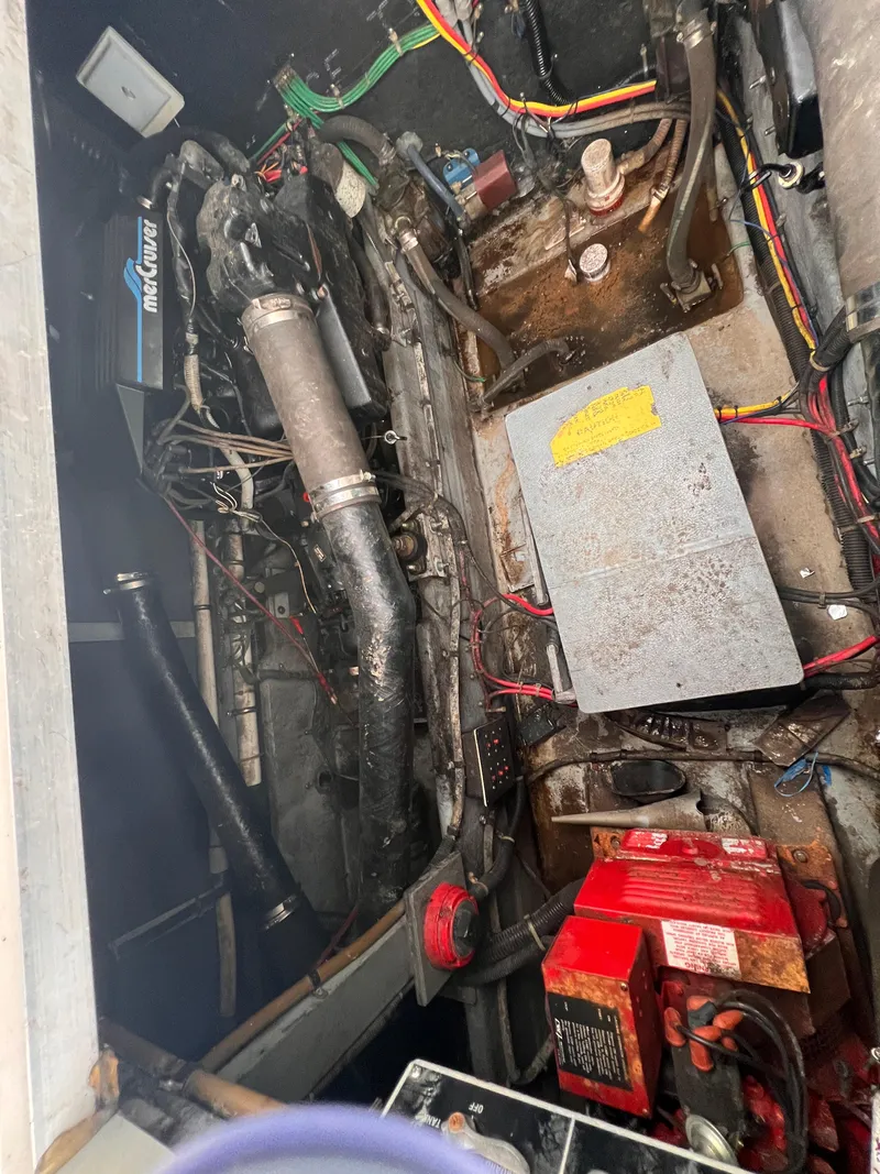 Slide: The Image of Interior of 1989 Sea Ray 390 Express Cruiser with modern amenities and cozy seating. - 31