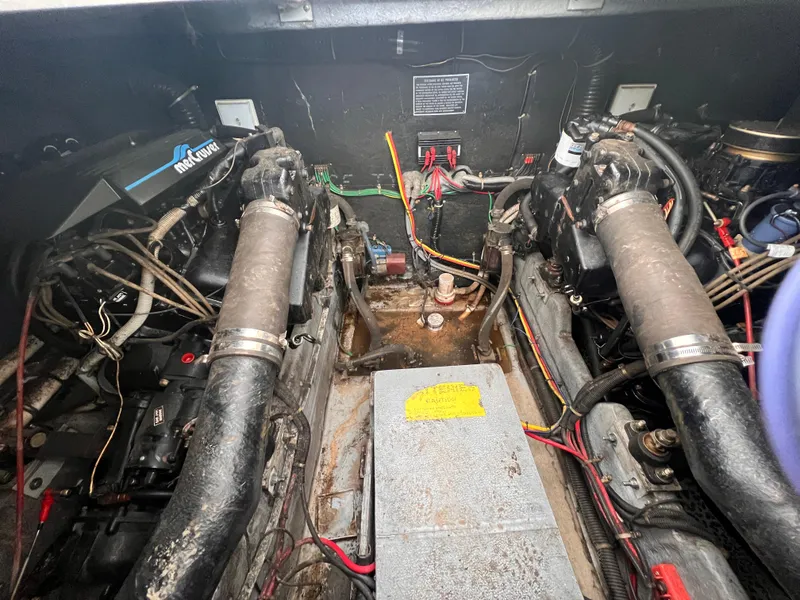 Slide: The Image of Engine compartment of a 1989 Sea Ray 390 Express Cruiser, showing wiring and components. - 34