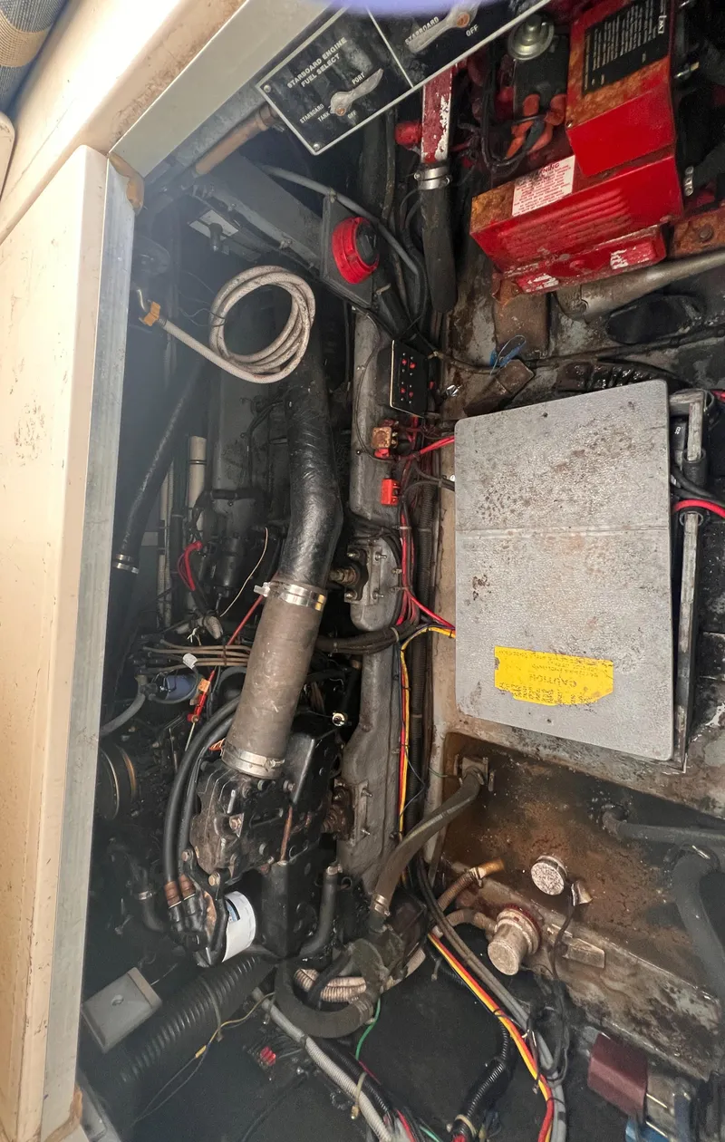 Slide: The Image of Engine compartment of a 1989 Sea Ray 390 Express Cruiser, showcasing mechanical components. - 35