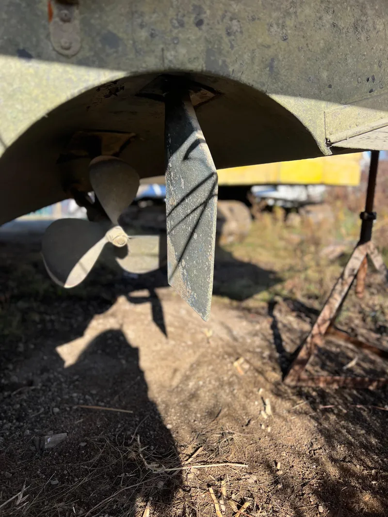 Slide: The Image of Engine compartment of a 1989 Sea Ray 390 Express Cruiser with visible components and wiring. - 36