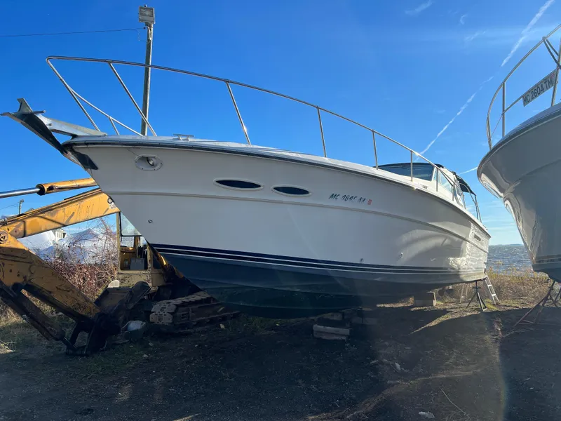 Slide: The Image of 1989 Sea Ray 390 Express Cruiser propeller and rudder on dry land. - 38