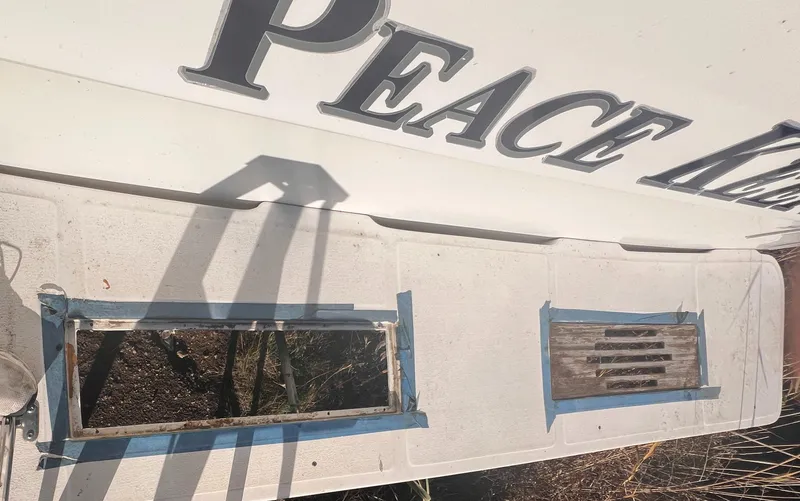 Slide: The Image of 1989 Sea Ray 390 Express Cruiser named "Peace Keeper" on dry dock. - 42
