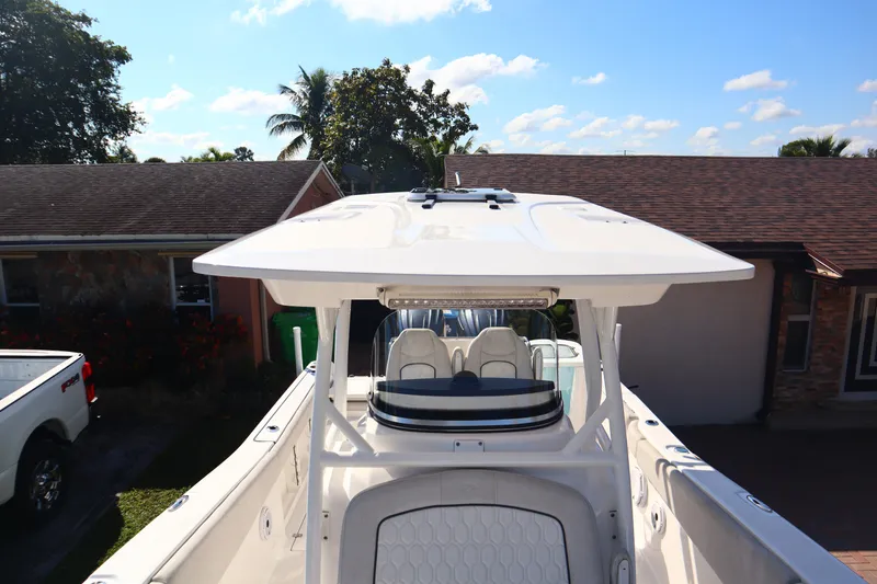 Slide: The Image of 2022 Sea Fox 288 Commander boat with T-top, parked in residential driveway. - 13