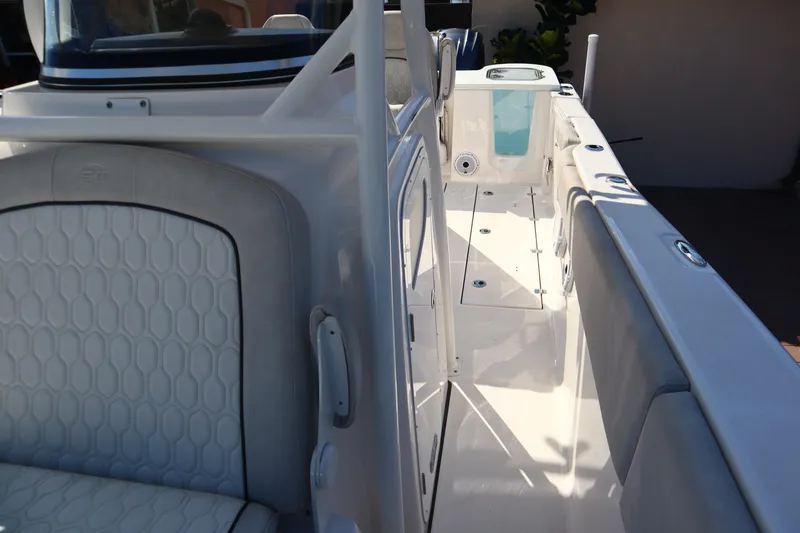 Slide: The Image of 2022 Sea Fox 288 Commander boat interior with white seating and sleek design. - 16