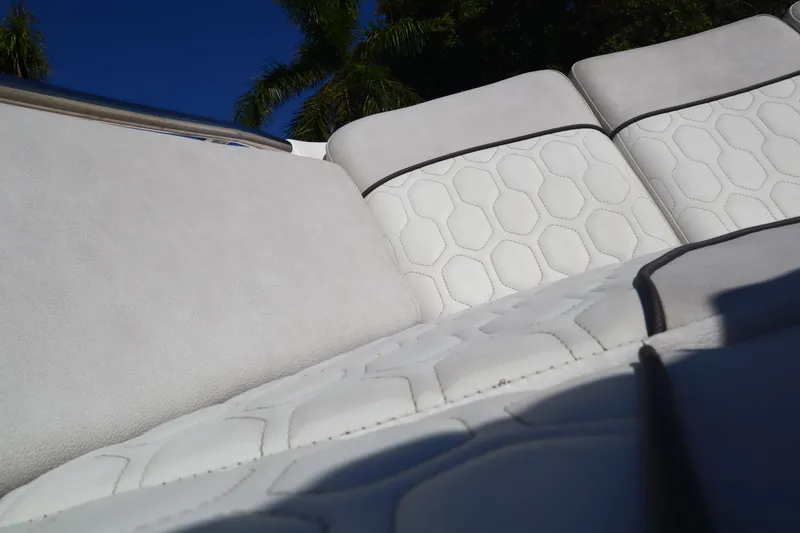 Slide: The Image of 2022 Sea Fox 288 Commander boat seating with hexagonal pattern under blue sky. - 17