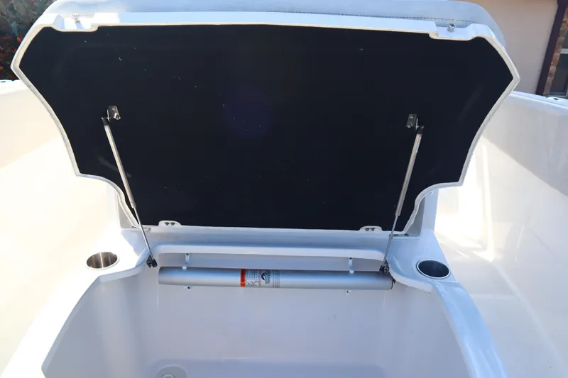 Slide: The Image of 2022 Sea Fox 288 Commander storage compartment with open lid and hydraulic support. - 18