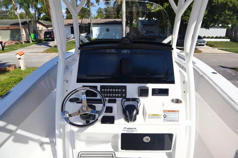 Slide: The Image of 2022 Sea Fox 288 Commander boat console with steering wheel and controls. - 28