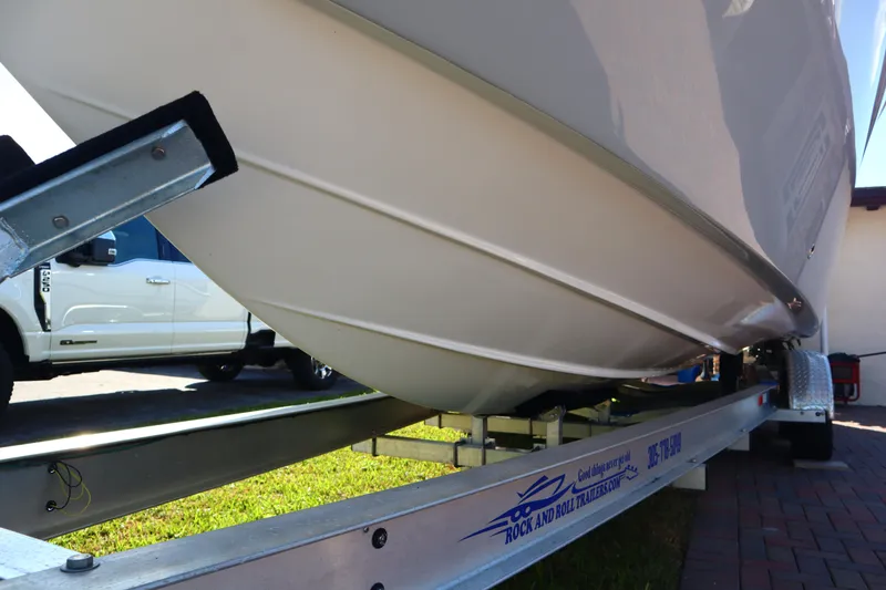 Slide: The Image of 2022 Sea Fox 288 Commander boat on trailer, side view, parked outdoors. - 3