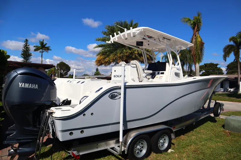 Slide: The Image of 2022 Sea Fox 288 Commander boat on trailer with Yamaha engine, parked outdoors. - 36