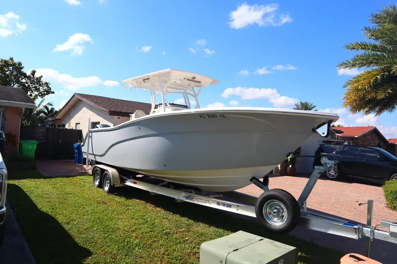 Slide: The Image of 2022 Sea Fox 288 Commander boat on trailer in residential driveway, sunny day. - 37